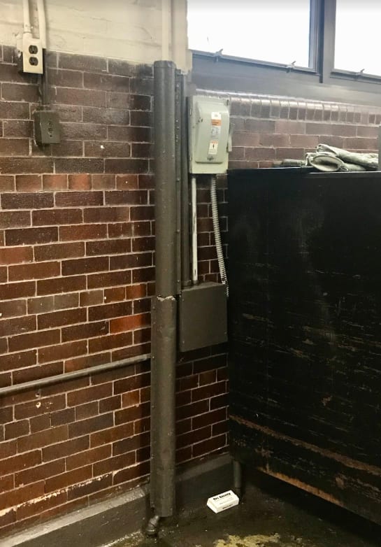 T.M. Peirce – 09.16.2019 – Accessible asbestos pipe insulation in basement hallway — metal “jackets” not properly secured resulting in potential contact damage and exposure